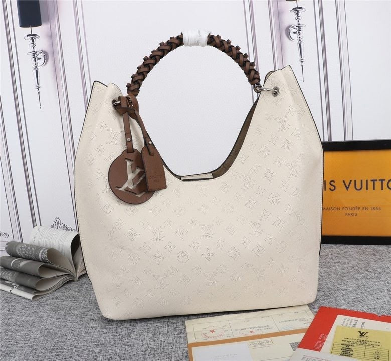 Monogram Taurin Handbags