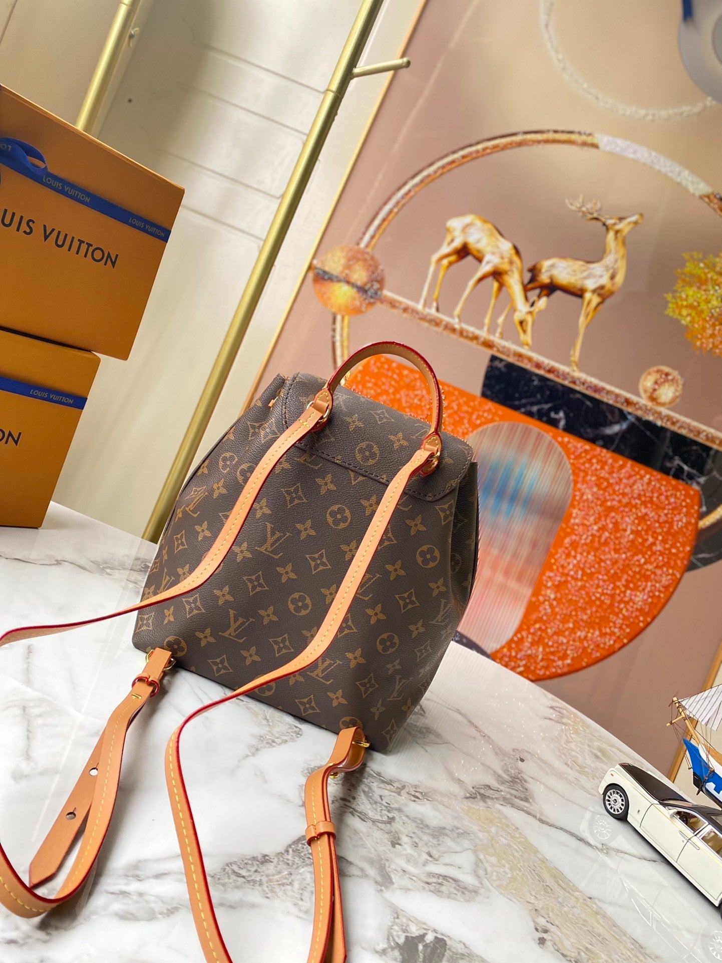 Monogram Sleek Mini City Backpacks