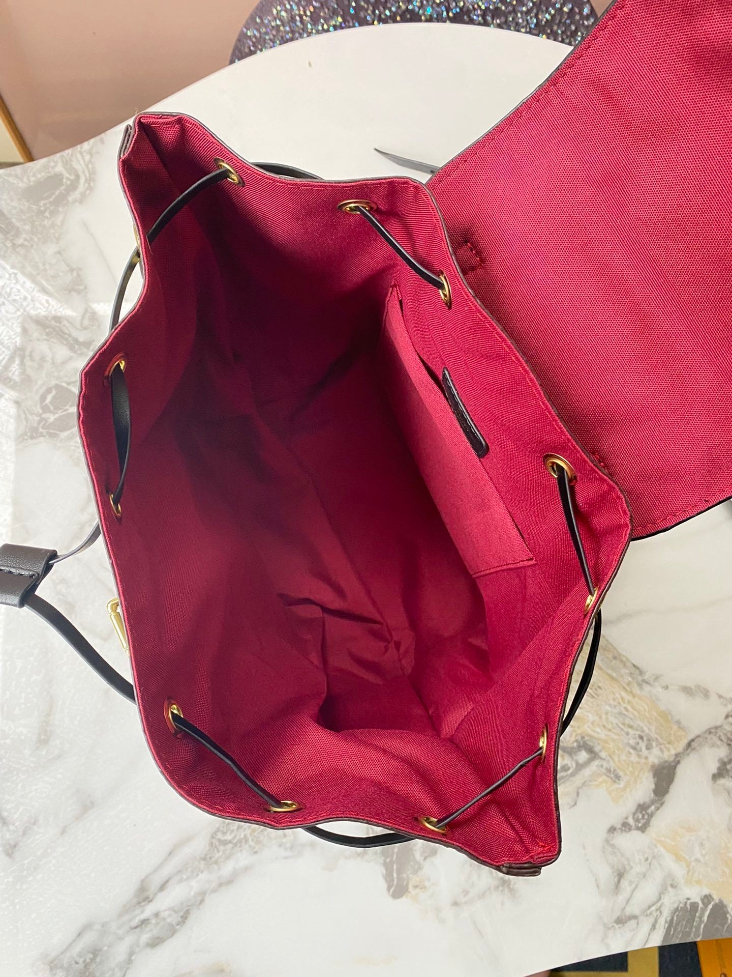 Monogram Sleek Mini City Backpacks