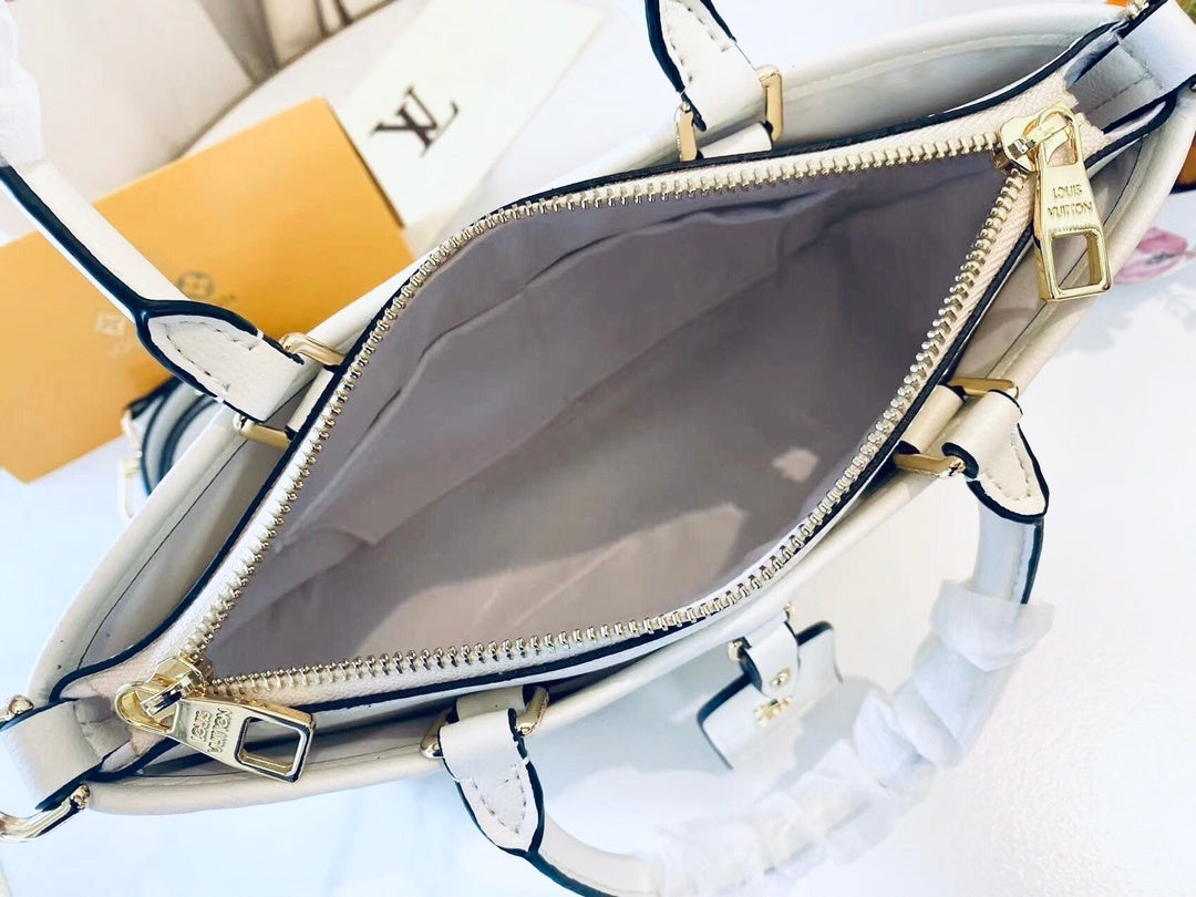 Monogram Tria Shoulder Bags