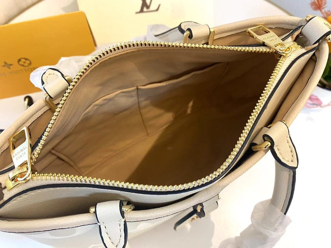 Monogram Tria Shoulder Bags