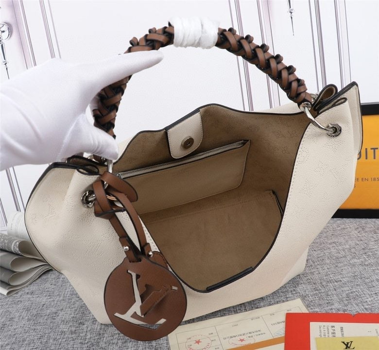 Monogram Taurin Handbags