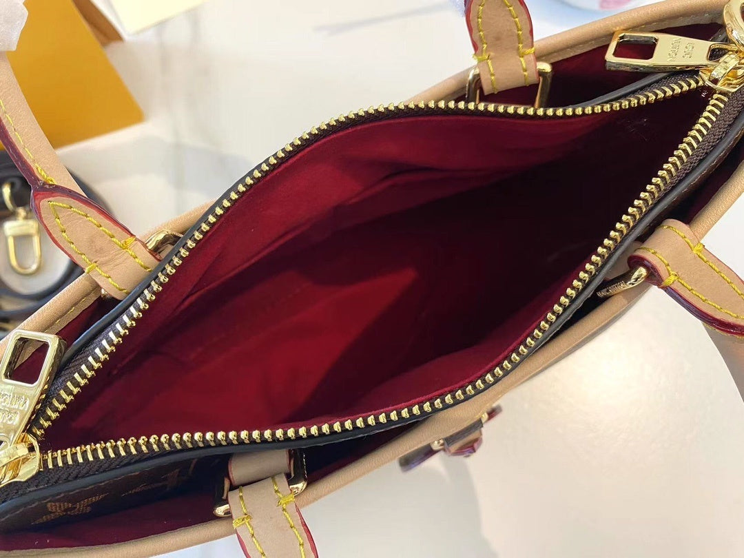 Monogram Tria Shoulder Bags