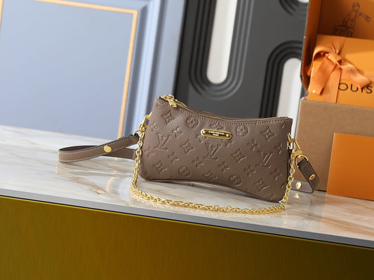 Tan Monogram On the Go Mini Bag