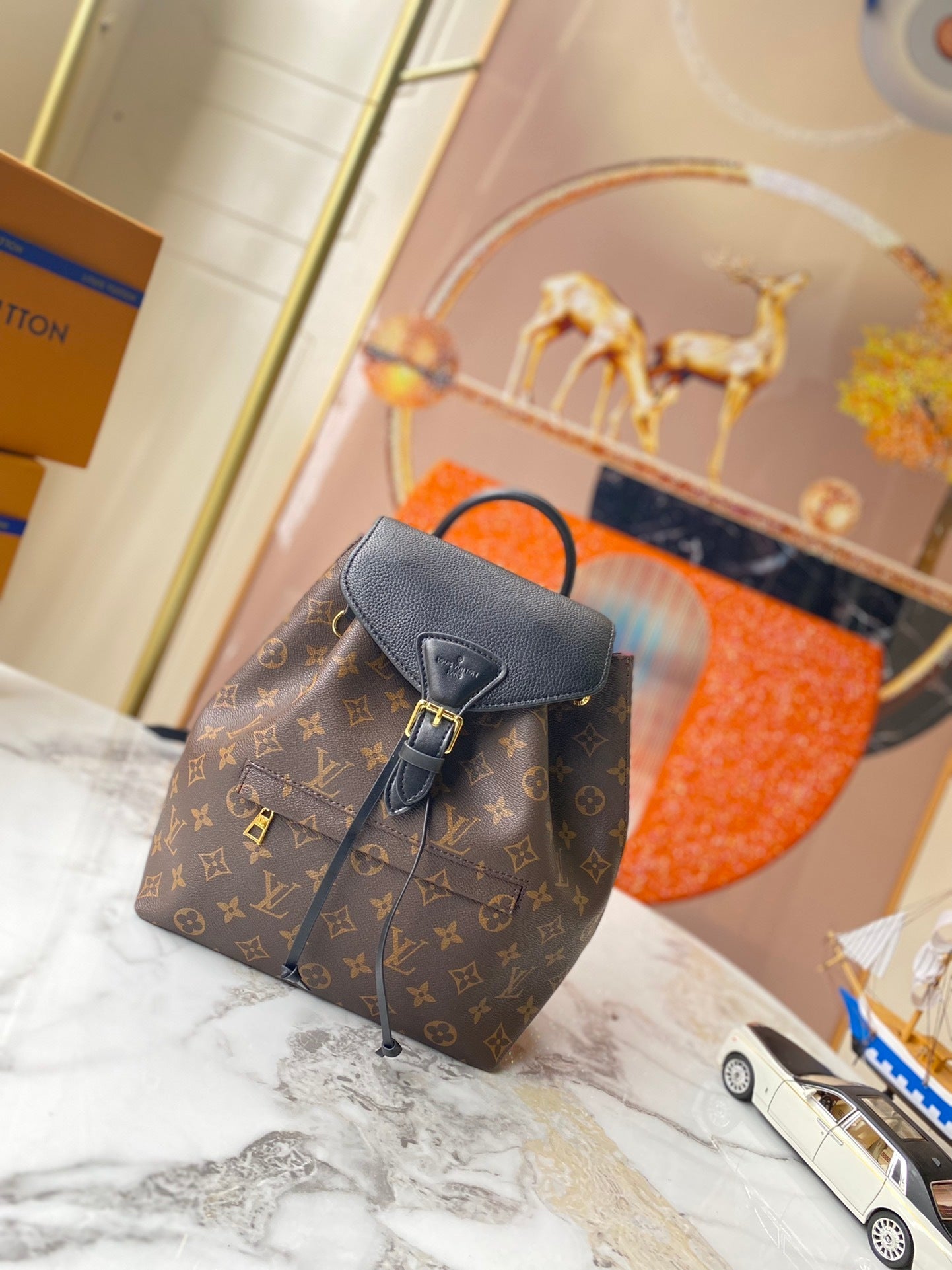 Monogram Sleek Mini City Backpacks